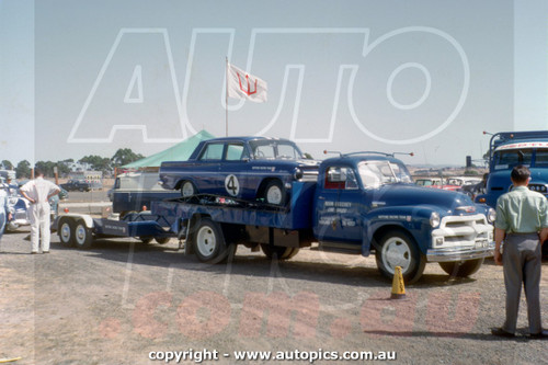 64SA09LJ7002 - Norm Beechey, Holden FX and S4 EH, Transporter, The Neptune Racing Team - Sandown International Motor Raceway, Springvale, Victoria, 1964 - Photographer Laurie Johnson