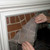 Peeling off Paint n Peel fireplace cleaner