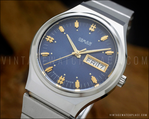 NOS Osman vintage automatic watch in stainless steel, with blue dial, rare indexes, day-date calendar and original steel bracelet.