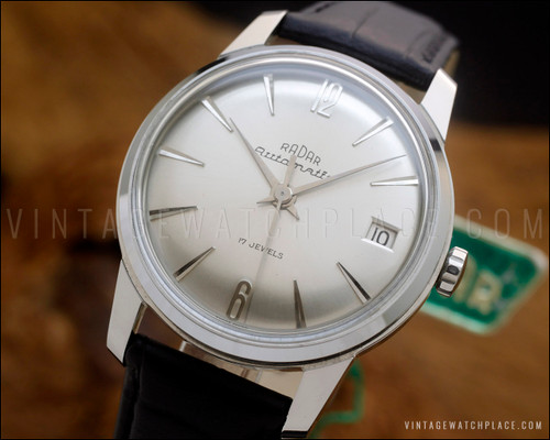 NOS Radar automatic vintage watch in stainless steel, with perfect silver dial, applied indexes, date window and brand new black Italian leather strap.
