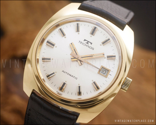 NOS Technos automatic vintage watch with silver sunburst dial, ETA 2783 movement, 20 microns gold-plated case and original black leather strap.