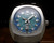 Detailed view of the vertical day-date window at 6 o'clock
