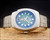 Front view of the Technos 10504 showing the original blue dial and vertical day-date display