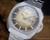 NOS Sakay 61365A automatic watch with original tags, gold textured dial, day-date calendar and faceted vintage case.