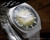 Angled view of the New Old Stock Sakay 61365A automatic, showing the dark green outer dial, warmer gold-toned centre, day-date window and crown-side case profile.