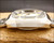 Opposite side profile of the Sakay 61365A, highlighting the polished case side, faceted lugs and high domed crystal.
