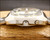 Crown-side profile of the Sakay 61365A NOS automatic, showing the case thickness, raised crystal, winding crown and date corrector.