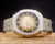 Front view of the vintage Sakay automatic watch, with champagne-gold textured dial, applied hour markers, luminous dots and day-date display.