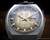 Close-up of the Sakay 61365A dial, showing the champagne-gold texture, darker smoky edge, automatic signature, hands, markers and framed day-date calendar.