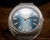 Close-up of the Osman 2250W3 blue dial, showing the automatic signature, applied markers, hands and date window.