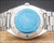 Caseback view of the Osman NS6633 automatic watch, showing the all-stainless-steel back, original bracelet and protective sticker.