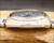 Side profile of the Osman vintage automatic watch, highlighting the stainless steel case, original Plexiglas crystal and 1970s case proportions.