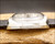 Side profile of the Osman vintage automatic watch, highlighting the all-stainless-steel case, original Plexiglas crystal and 1970s case proportions.