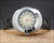 Front display of the Voga NOS automatic watch, showing the stainless steel cushion case, green fumé dial layout, day-date window and black perforated strap.