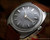 Close-up view of the Stelwatch automatic dial, showing the grey fumé finish, applied hour indexes, subtle signs of age and date display.