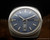 Front view of the Titan Submerger automatic watch, with blue-grey dial, raised silver-tone indexes, silver-tone hands and Spanish day-date display.
