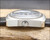 Crown-side profile of the Titan Submerger NOS automatic, showing the stainless steel case, original crown, Plexiglas crystal and black perforated strap connection.