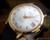 Close-up view of the Aureole automatic dial, highlighting the perfect silver finish, Incabloc Automatic text, applied indexes and framed date display.