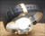 Brand new black Italian leather strap fitted to the Solvil et Titus Titus Matic watch, shown with gold-tone buckle and 18 mm marking.