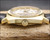 Crown-side profile of the Solvil et Titus Titus Matic watch, showing the original signed crown, gold-plated case and perfect Plexiglas crystal.