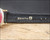 
Inside view of the original black Zenith leather strap, showing the gold Zenith name and logo stamped on the leather lining.

