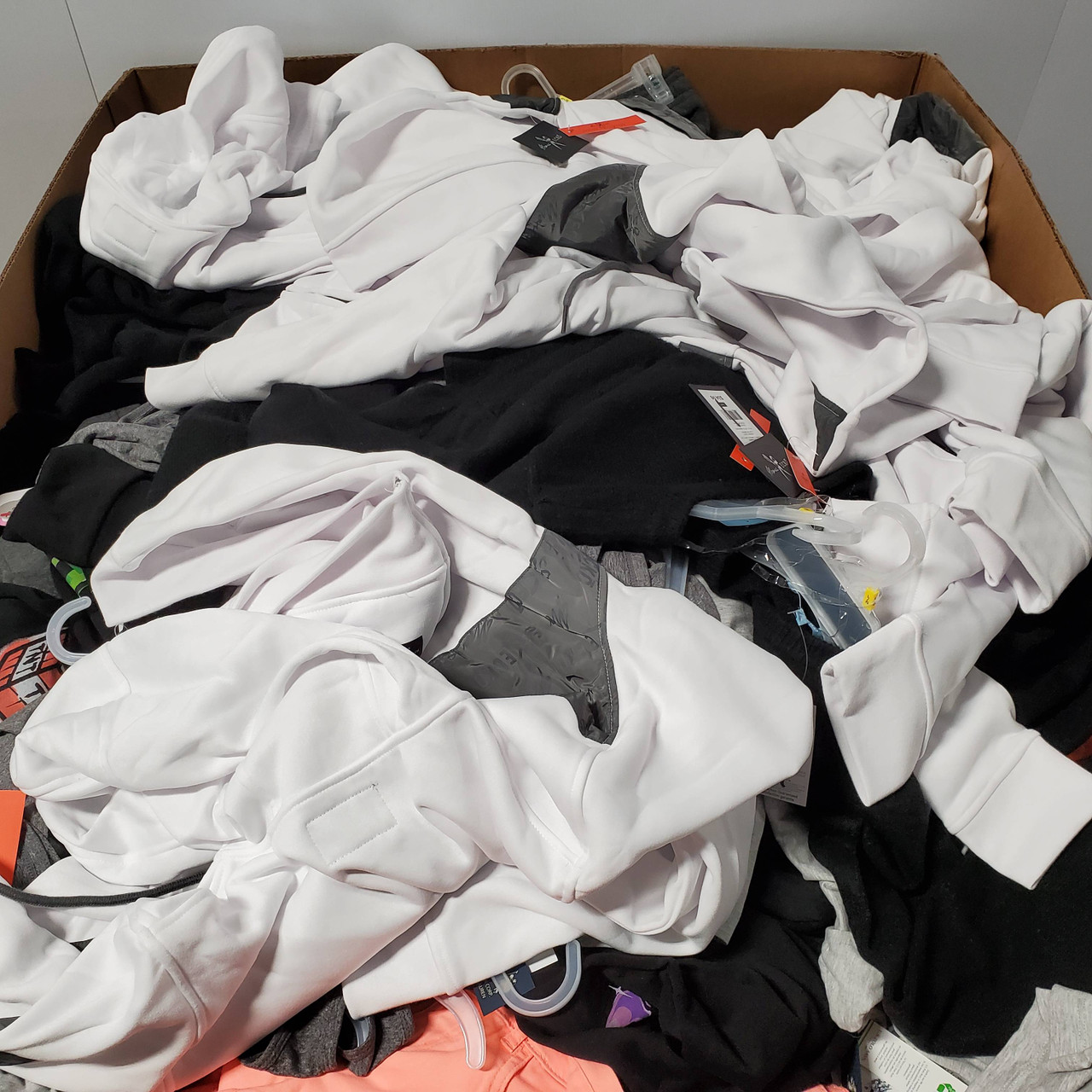 477 units of Clothing & Accessories - MSRP $8,557 - Returns (Lot # 690429)
