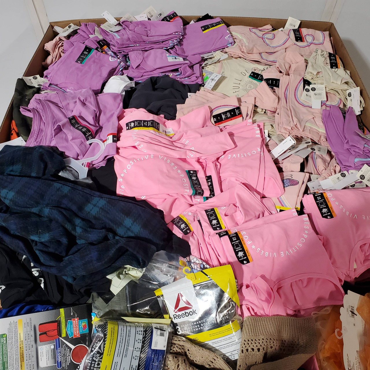 1059 units of Clothing & Accessories - MSRP $12,323 - Returns (Lot # 836344)