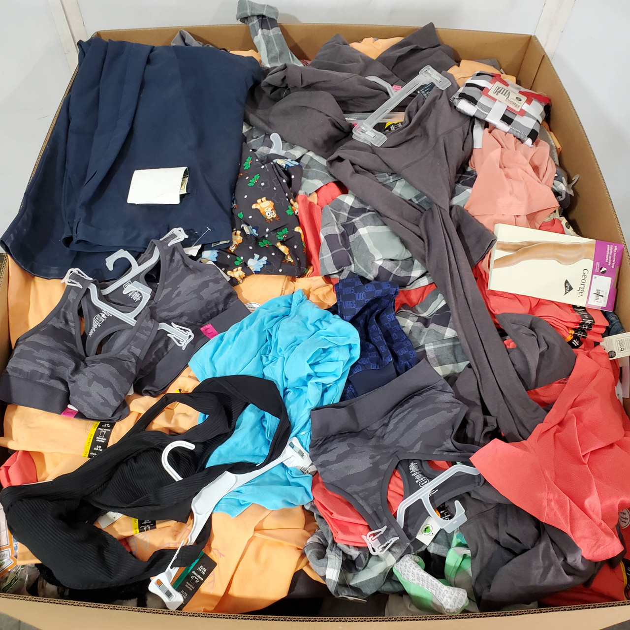 1012 units of Clothing & Accessories - MSRP $14,617 - Returns (Lot # 899009)