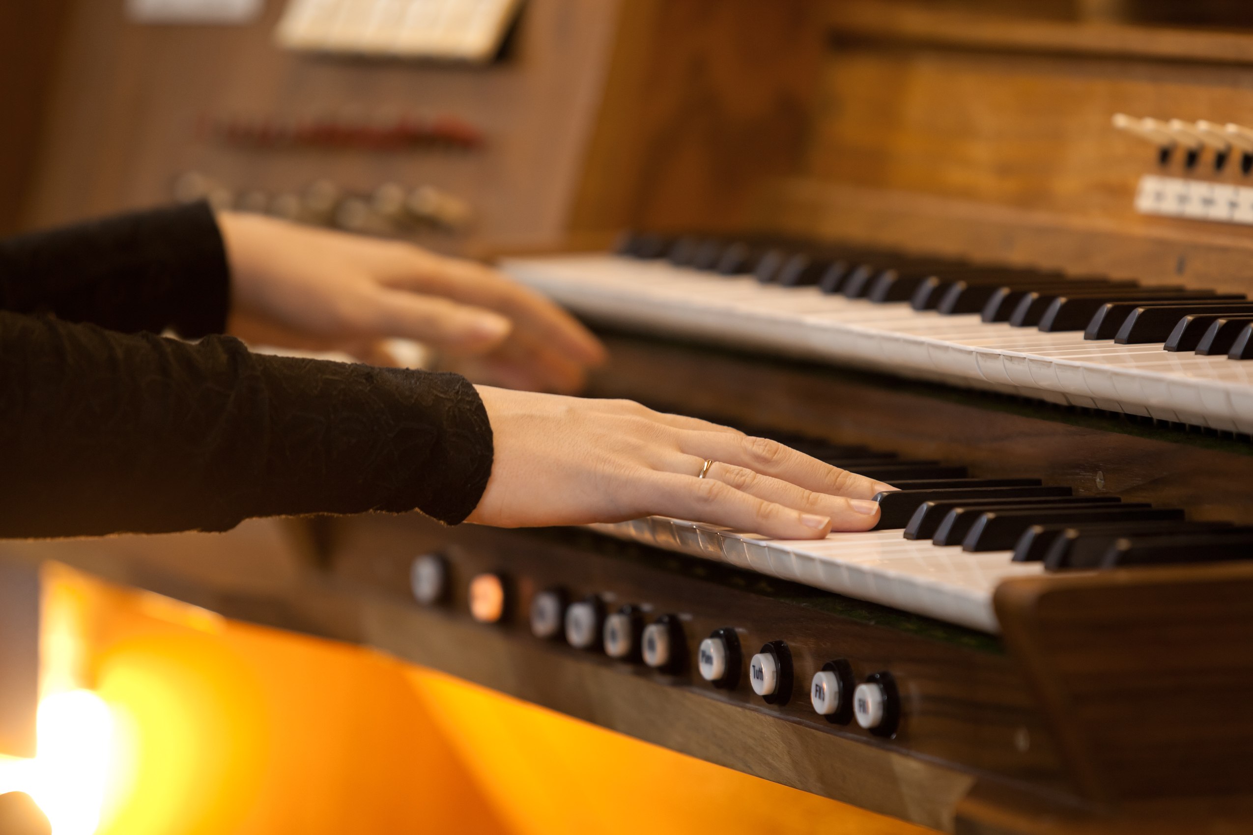 Organist hands playing traditional church organ