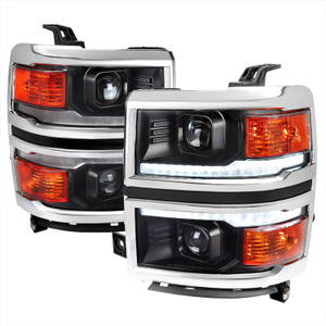 Fits 2014-2015 Chevrolet Silverado 1500 Spec-D Tuning Headlight Assembly 2LHP-SIV14JM-C-SQ-RS H7 Halogen High Beam/H7 Halogen Low Beam; Clear Lens With Chrome Trim; ABS Plastic Matte Black Housing; DOT/SAE Approved; Set Of 2