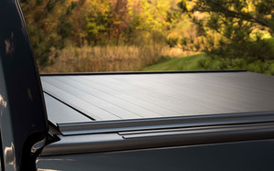 Revolutionize Your Truck Bed with Retrax PowertraxPro MX Tonneau Cover | Remote Control Lock | Black Matte Aluminum | Wireless Operation | Flush Front Cover | Easy Installation