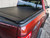 Pace Edwards Tonneau Cover KRF189 UltraGroove; Manual Retractable; Black Matte; ArmorTek Vinyl Over Aluminum; Lockable Using Tailgate Handle Lock; With Canister And Standard Rails Kit