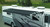 Carefree RV Awning IY2010JV Springless; Patio Awning; Electric; 20 Foot Length x 8 Foot Extension; Cadet Gray; Solid Acrylic; Black Alumaguard; Adjustable Pitch; Required Arms Must Be Purchased Separately