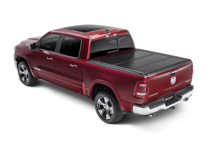 Transform Your Ram 1500 with UnderCover Hard Folding Tonneau Cover | 2 Folds/3 Panels, Non-Lockable, Black Aluminum Design