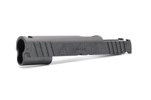 Custom pistol slide featuring deep engraved topographic contour patterns with a matte Cerakote finish, showcasing precision laser engraving and layered terrain-inspired detailing across the slide surface.