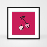 Graphic art print of cherries by designer Jacky Al-Samarraie.  The print is shown in a black aluminium frame.