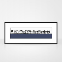 Landscape print of Northumberland countryside by designer Jacky Al-Samarraie.  The print colour is blue.  The print is shown in a frame for reference.