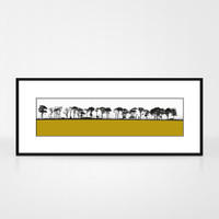 Landscape print of Northumberland countryside by designer Jacky Al-Samarraie.  The print colour is mustard. The print is shown in a frame for reference.