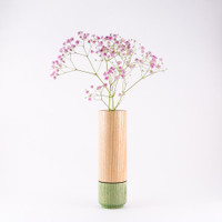 Peppermint wood stem vase by designer Jacky Al-Samarraie, with flowers in glass tube