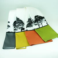 Set of four brightly coloured cotton tea towels with a landscape tree design, The Art Rooms