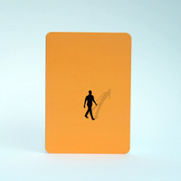 Man silhouette greeting card in orange by Jacky Al-Samarraie