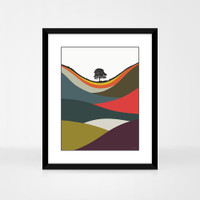 Sycamore Gap Multicoloured landscape print by designer Jacky Al-Samarraie, in a black frame.