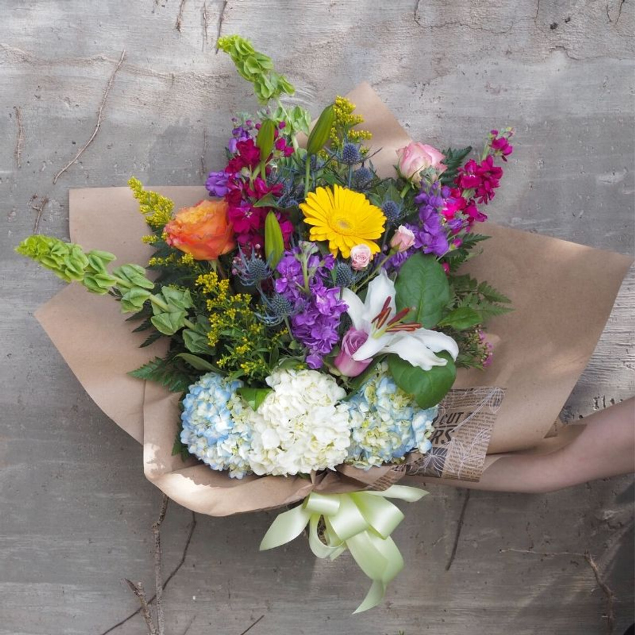 Large Beautiful bouquet of mixed flowers in woman hand. Floral shop concept  . Beautiful fresh cut bouquet. Flowers delivery Stock Photo - Alamy