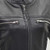 Close-up of women’s café racer leather jacket chest, vented chest pocket by First MFG