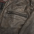 Close-up of zippered chest vent on First MFG Distressed Leather Motorcycle Jacket for airflow