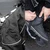 Motorcycle rain suit pants featuring adjustable hook and loop ankle closures to fit securely over riding boots