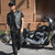 Model Wearing Unik Short Collarless Leather Motorcycle Vest on Motorcycle