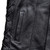 Adjustable side lace detail on a black leather biker vest for expandable fit over jackets