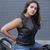 Tailored women's collarless leather biker vest with clean single panel back