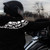Milwaukee Leather armored motorcycle hoodie under low light showing the highly reflective skull pattern